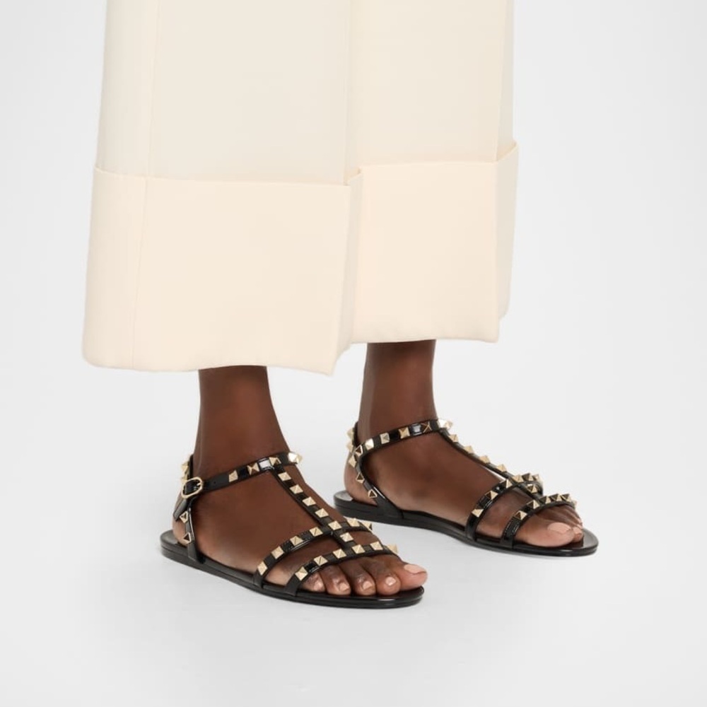 Damaged Valentino Garavani Rockstud Jelly Flat Gladiator Sandals in Black